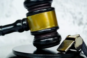 Close up view of lawyer gavel and whistle